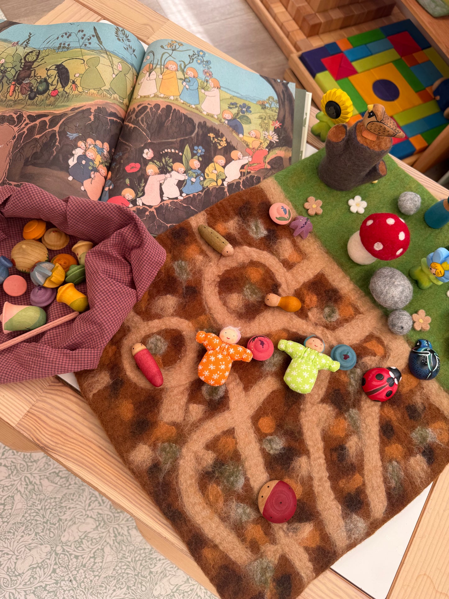 Below the garden felt play mat