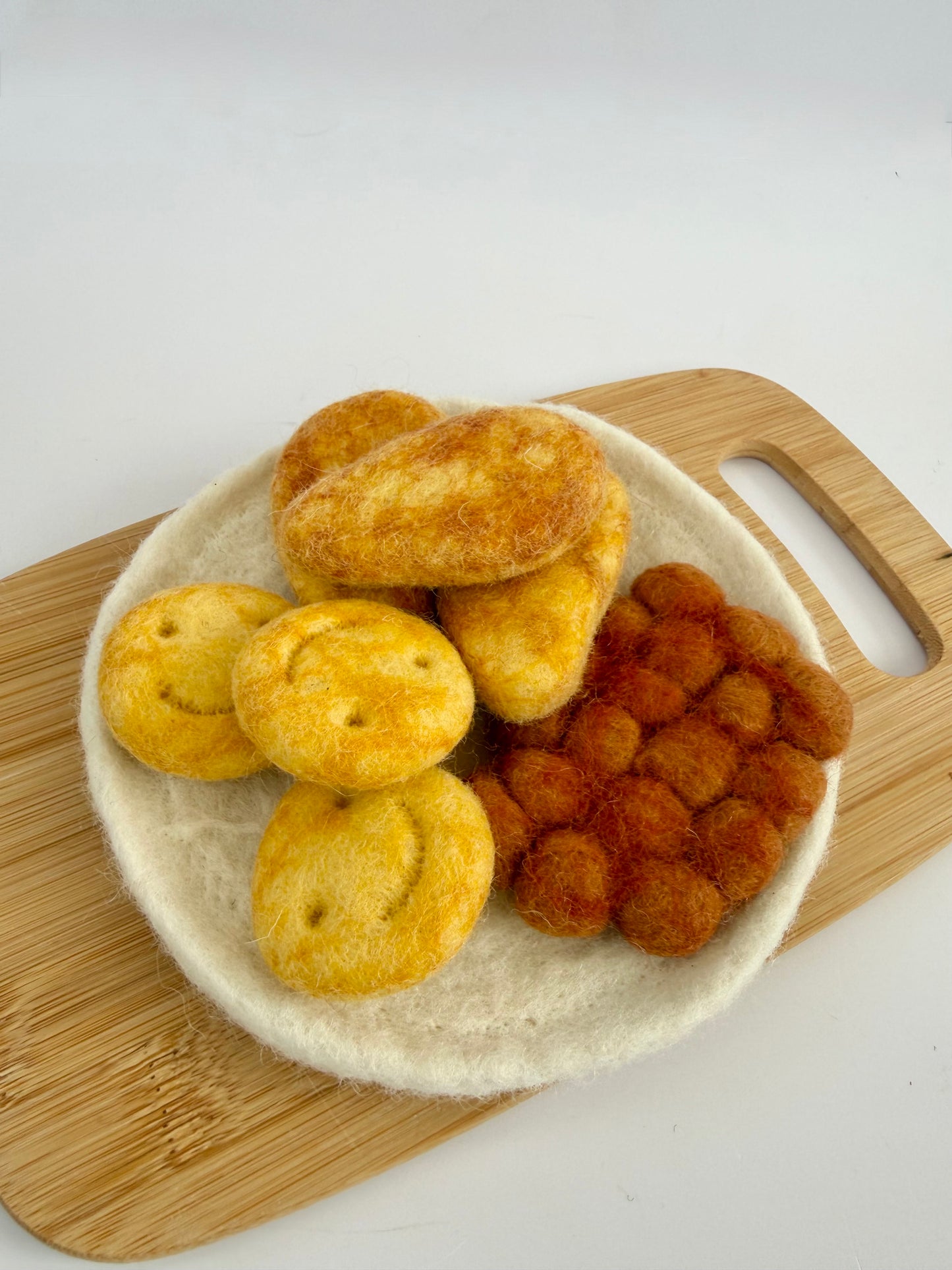 Felt chicken dippers and smiley faces play food set