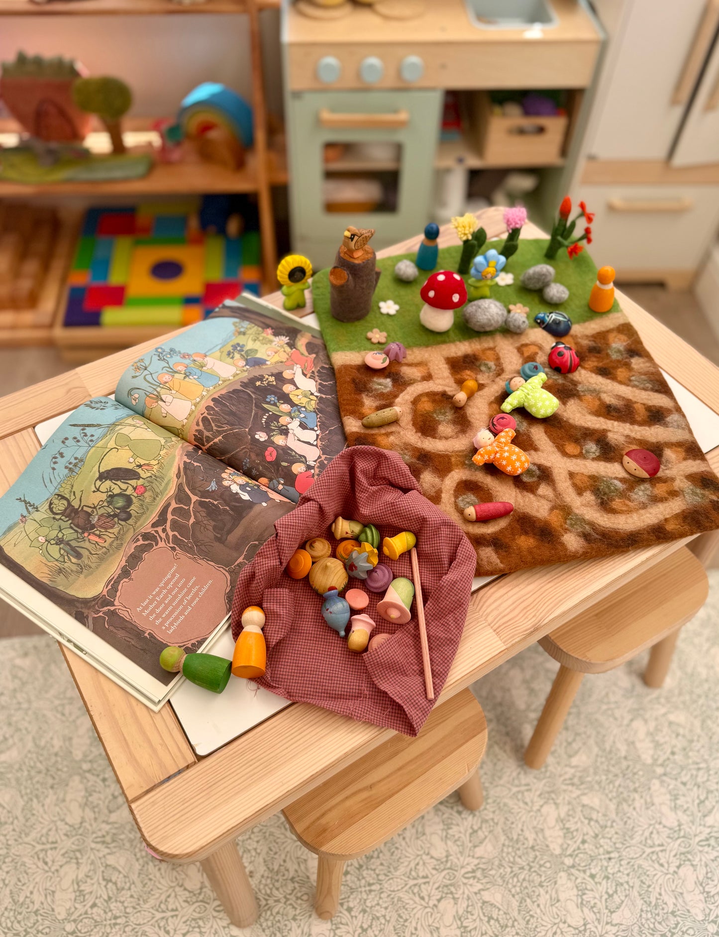 Below the garden felt play mat